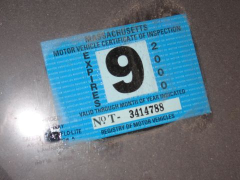 1991 Ford LTD Crown Victoria - Photograph of a Massachusetts vehicle inspection certificate sticker showing expiration and serial number.