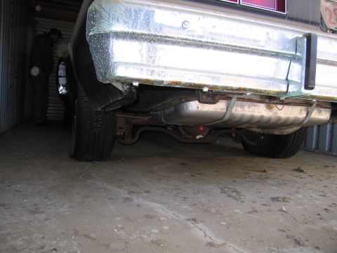 1991 Ford LTD Crown Victoria - Photograph of rear undercarriage and exhaust, not a technical document.