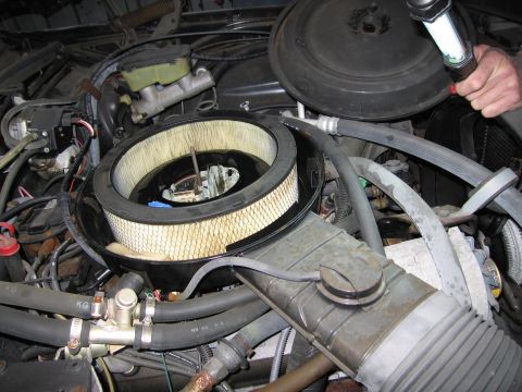 1991 Ford LTD Crown Victoria - Photograph of an engine air cleaner and hoses, not a technical document.
