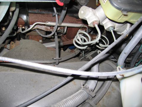1991 Ford LTD Crown Victoria - Photograph of engine vacuum lines and components, not a technical document.
