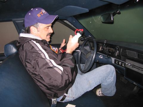 1991 Ford LTD Crown Victoria - Photograph of a person in a car interior, not a technical document.