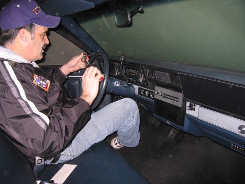 1991 Ford LTD Crown Victoria - Photograph of a person in a car interior, not a technical document.