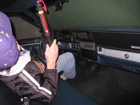 1991 Ford LTD Crown Victoria - Photograph of a person in a car interior, not a technical document.