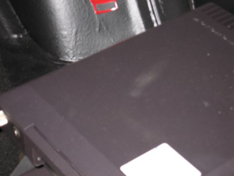 1991 Ford LTD Crown Victoria - Photograph of a dark electronic box mounted in a vehicle interior, not a technical document.