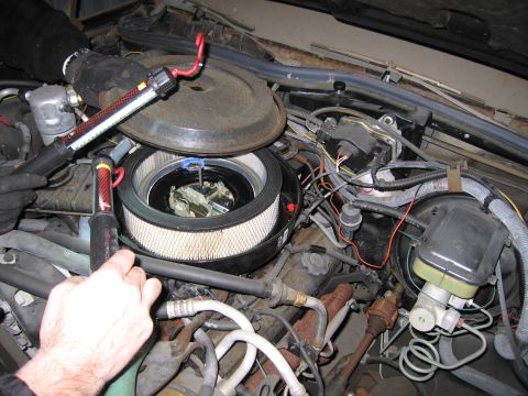 1991 Ford LTD Crown Victoria - Photograph of an open air cleaner housing and engine components, not a technical document.