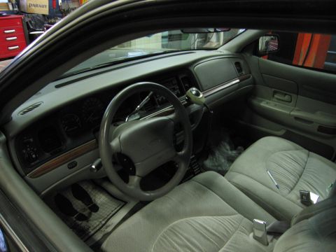 1991 Ford LTD Crown Victoria - Photograph of a Ford Crown Victoria interior showing steering wheel, dash, and front seats, not a technical document.