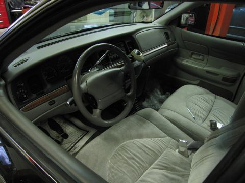 1991 Ford LTD Crown Victoria - Photograph of a Ford Crown Victoria interior with steering wheel and seats, not a technical document.