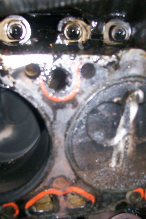 1992 Ford C-350 (Centurion Conversions) - Close-up view of an engine's cylinder head, showing internal components and signs of wear.