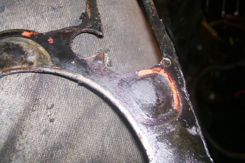 1992 Ford C-350 (Centurion Conversions) - Close-up of a damaged engine gasket, likely from a head gasket repair.