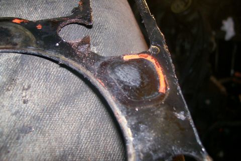 1992 Ford C-350 (Centurion Conversions) - This image shows a damaged engine gasket, likely from a vehicle's engine.
