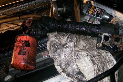1992 Ford C-350 (Centurion Conversions) - Engine components and an oil filter are visible, suggesting maintenance or repair work.