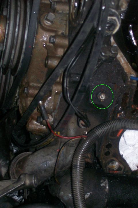 1992 Ford C-350 (Centurion Conversions) - Close-up of an engine component, possibly related to a head gasket repair.