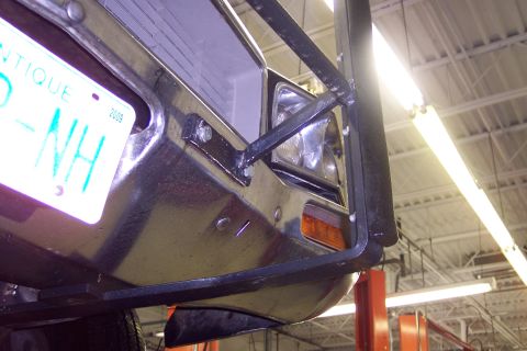 2001 Ford Crown Victoria - Close-up of a vehicle's rear bumper and license plate, showing a 2009 sticker.