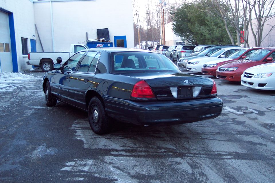 2001 Ford Crown Victoria parked in a lot with other cars visible