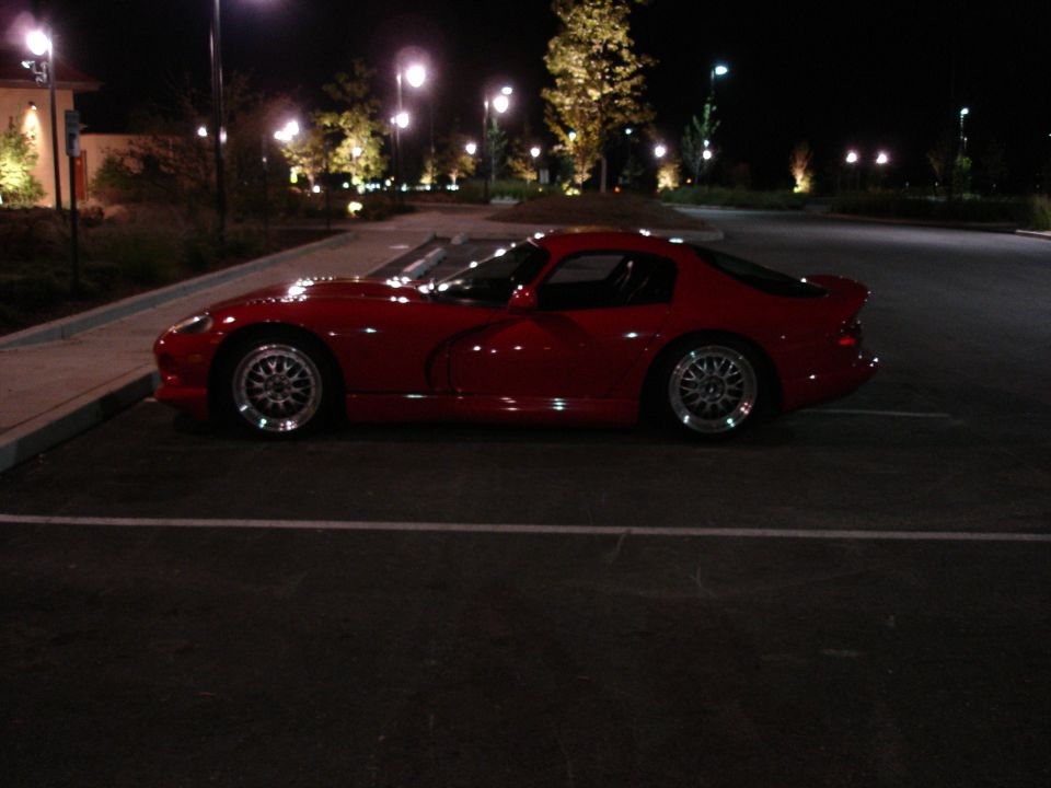 Red Dodge Viper parked at night
