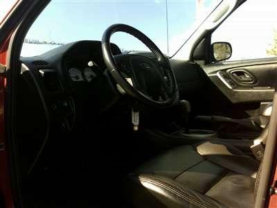 2006 Ford Escape - Interior view of a car's dashboard and steering wheel.