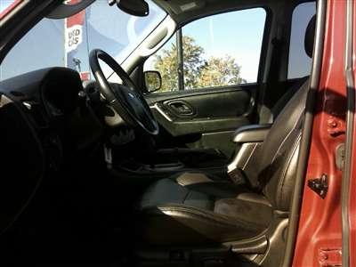 2006 Ford Escape - Interior view of a dark-colored SUV, showing the dashboard and steering wheel.