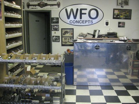 1989 Ford Bronco - Photo of the WFO Concepts shop interior with parts bins and counter, not a technical document.