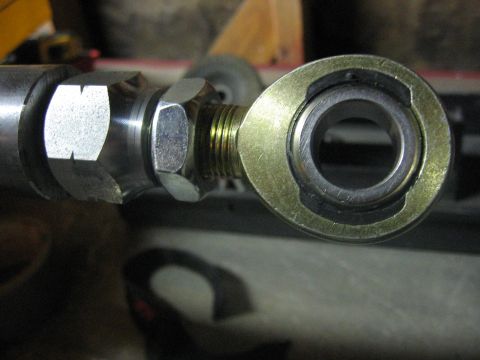1989 Ford Bronco - Close-up view of a rod end joint assembly, showing the threaded shaft and hex nut.