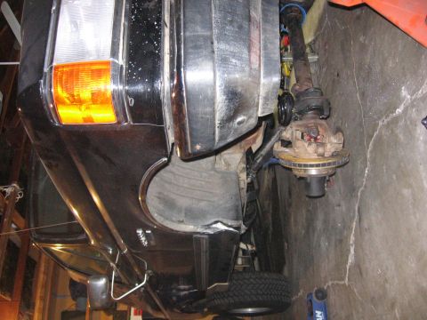 1989 Ford Bronco - Front wheel assembly and fender of a 1989 Ford Bronco during installation.