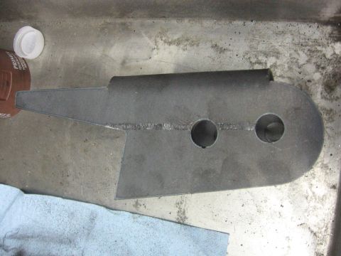 1989 Ford Bronco - Metal bracket with two holes, possibly for installation or repair.