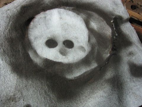 1989 Ford Bronco - A skull stencil is visible on a piece of fabric, marked by spray paint.