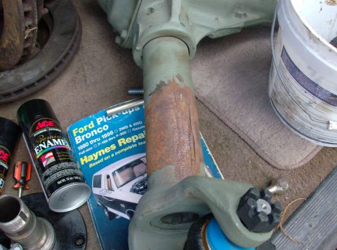 1989 Ford Bronco - A Dana 44 axle component is shown with a Haynes repair manual for Ford Pick-ups and Bronco models from 1980-1996.