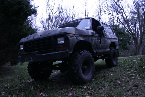 1979 Ford Bronco - This lifted 1979 Ford Bronco sits parked in a wooded area.