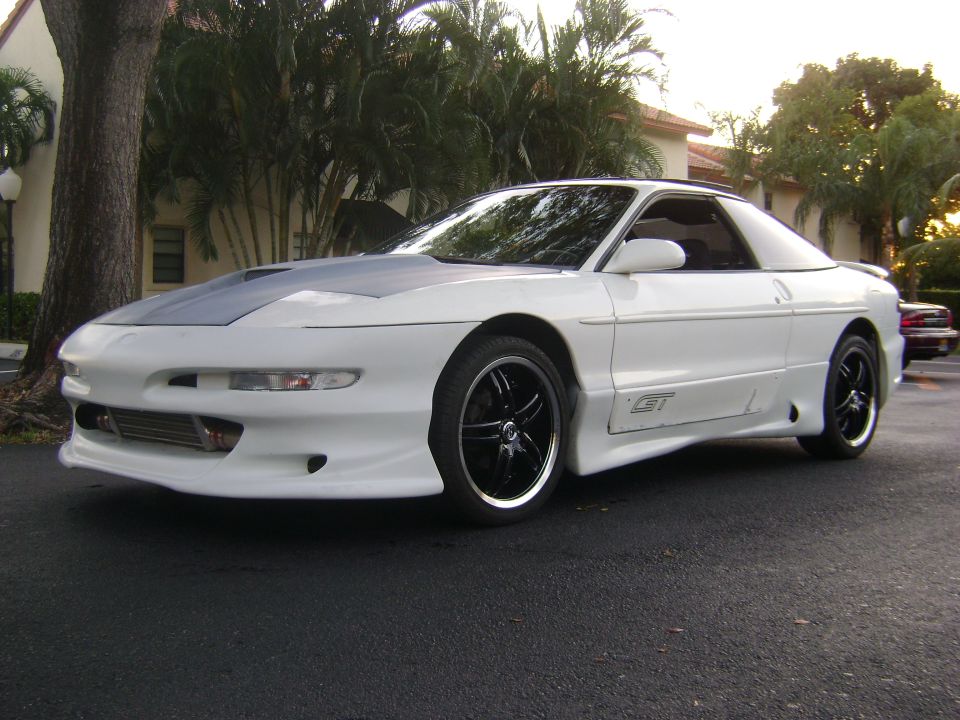 White 1994 Ford Probe GT with grey hood and custom wheels, 3q-front view