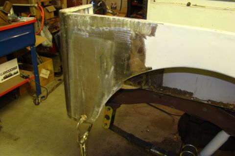 1948 Jeep Wrangler - A vehicle body panel undergoes repair work, with visible welding and grinding.