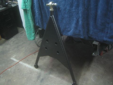 1990 Ford Bronco - Photograph of a black-painted triangular fabricated tripod stand standing on a shop floor.