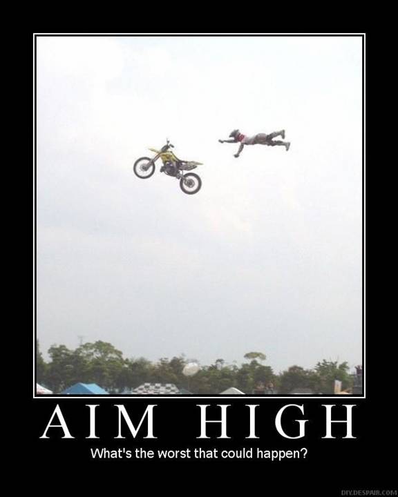 Motocross rider and motorcycle in mid-air jump with motivational text.