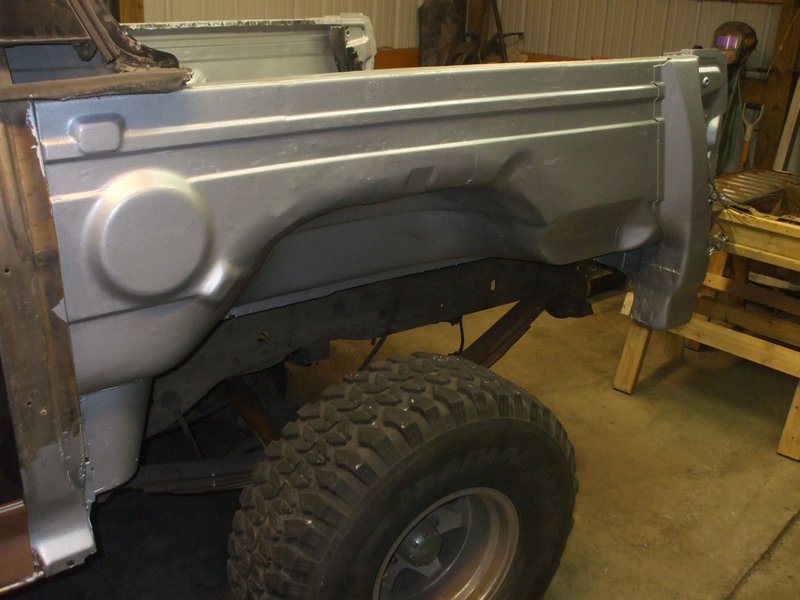 first coat of rust bullet on drivers side tub