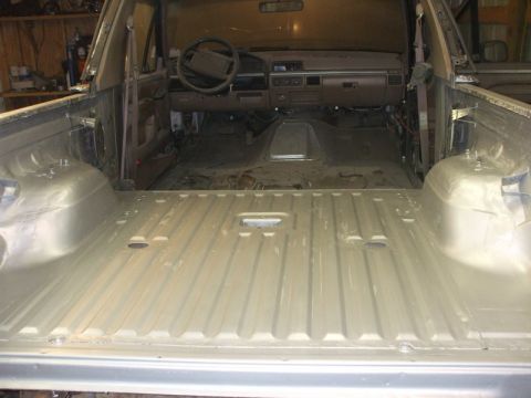 1995 Ford Bronco - first coat of rust bullet inside tub
