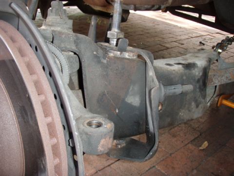 1996 Ford Bronco - For the life of me, i couldn't figure out what this bracket is for, the one with the stud pointing to the right. I couldn't get all the hol…