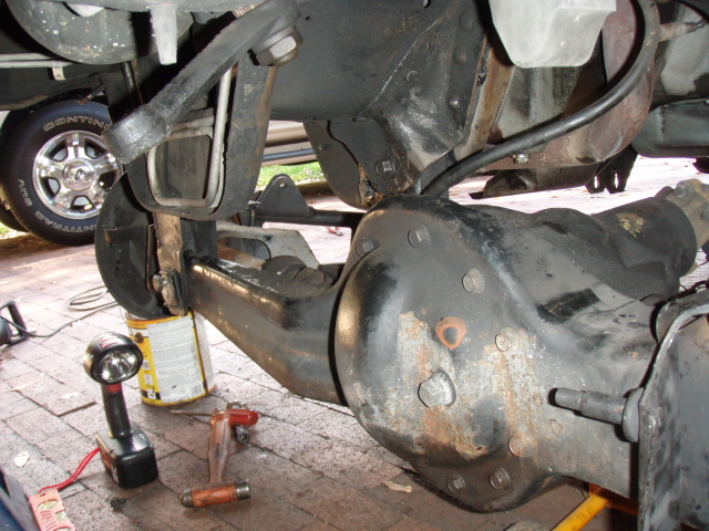 Close-up of a vehicle's rear differential and suspension system.