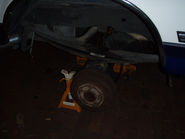 Rear add a leaf.  Starting the tightening of the new center bolt.  And its getting darker.