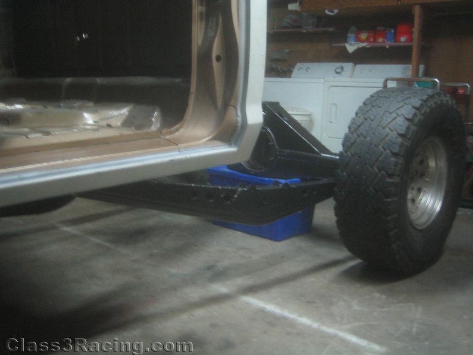 Lower side view of a truck rocker and fabricated suspension link