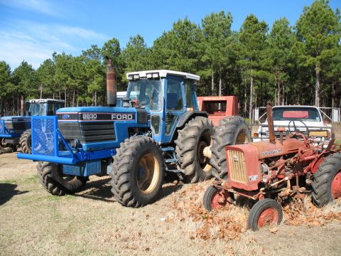 1993 Ford Bronco - shiny new brushguards on the tractors. the bushes and trees screw up the side panel sliders. Cool little Farmall 140 too
