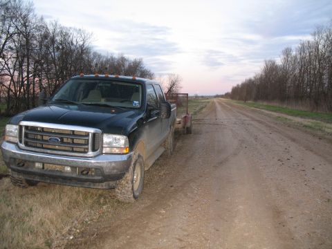 1993 Ford Bronco - while refilling the planter, I got a quick shot of the 02. We're in the river bottoms, check out the long, straight road. This has been far…