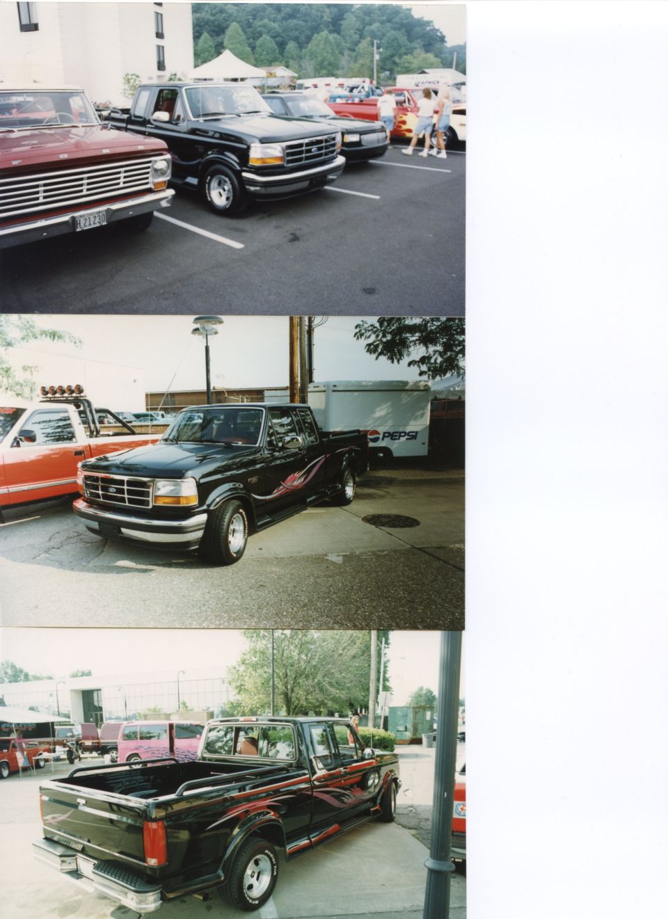 Black Ford F-250 truck with flame decals parked on pavement