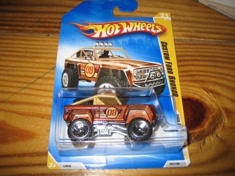 1995 Ford Bronco - A Hot Wheels toy Bronco is displayed in its original packaging, alongside a graphic illustration of the vehicle.