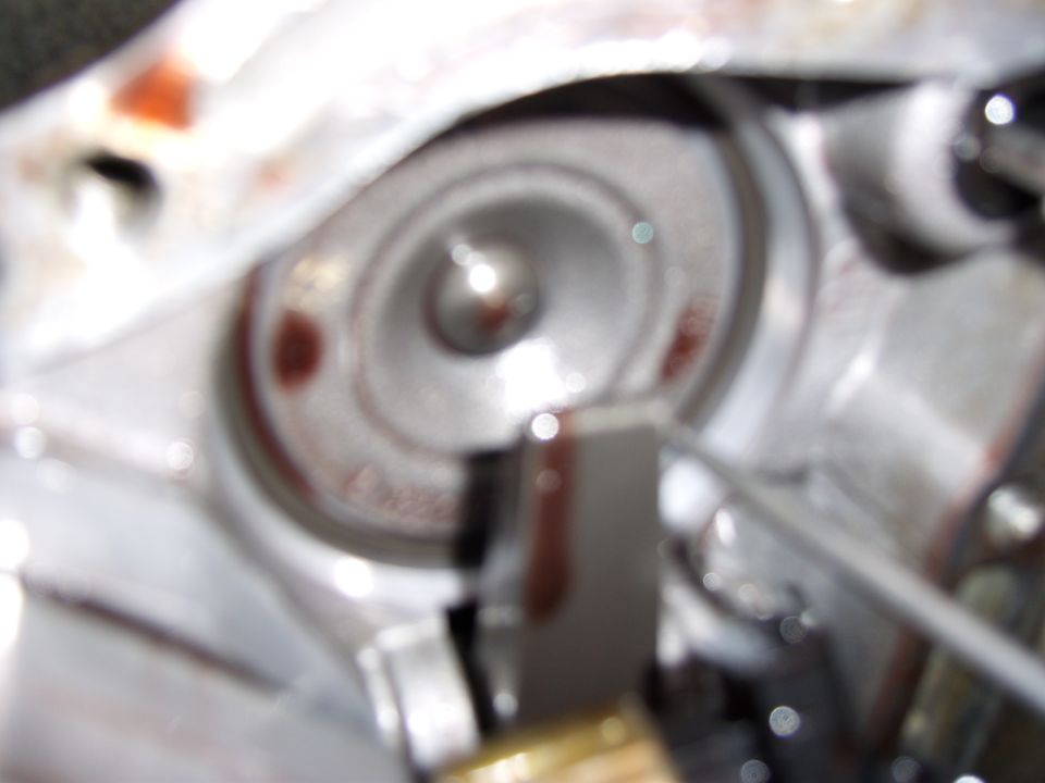 Close-up of a torque converter with fluid stains.