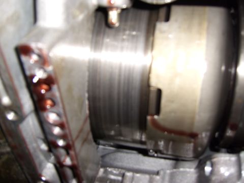 1972 Ford Ranchero - This close-up image shows a section of a transmission, likely from a 1972 Ford Ranchero. Red fluid is visible on some of the metallic compo…