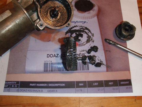 1994 Ford Bronco - A disassembled automotive gear assembly with grease is laid out on top of a parts invoice. The invoice shows part number DOAZ-62234A24-B fo…
