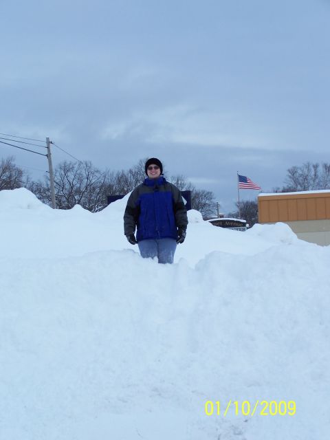 1989 Ford F-150 - Deep snow covers the ground, with a person standing in the middle of it all.