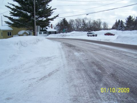 1989 Ford F-150 - A winter scene shows a snow-covered road with two vehicles parked nearby. The date 01/10/2009 is visible.
