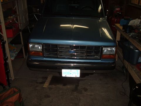 1990 Ford Ranger - Front view of a 1990 Ford Ranger showing its grille and headlights.