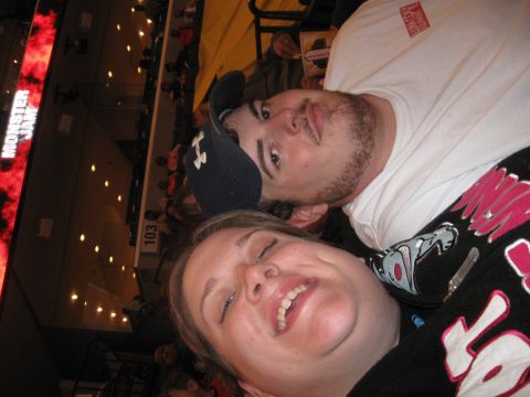 1994 Ford Bronco - Two people pose for a selfie at a Monster Jam event, with a large screen displaying the event name in the background.