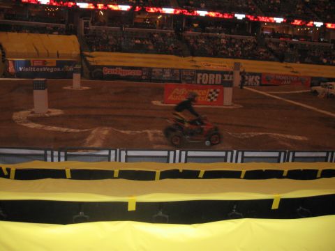 1994 Ford Bronco - An ATV navigates a dirt track during an event.